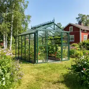 Vihreä Robinsons Royale -kasvihuone puutarhassa
